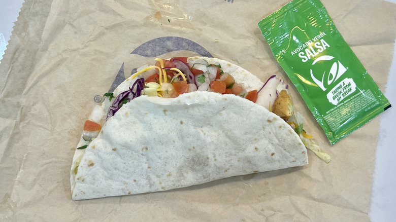 Taco Bell Cantina Chicken Soft Taco with salsa on wrapper.