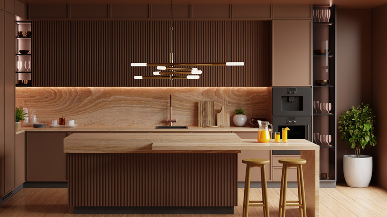Coffee brown kitchen with wooden countertops.