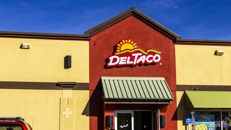 Del Taco storefront in front of blue sky