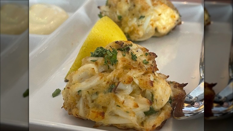 Crab cake on plate with lemon