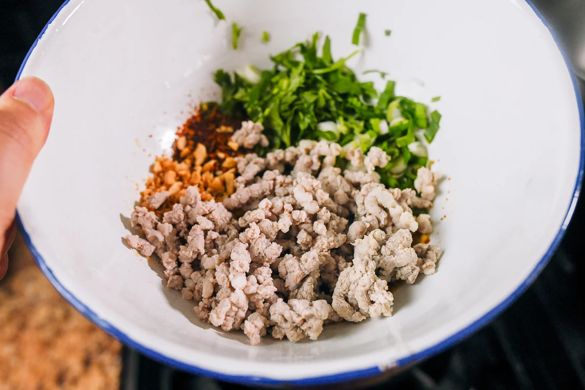 ground pork and toppings in bowl