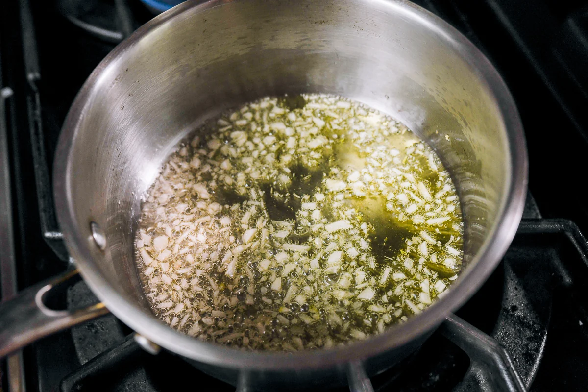 frying finely chopped garlic in oil