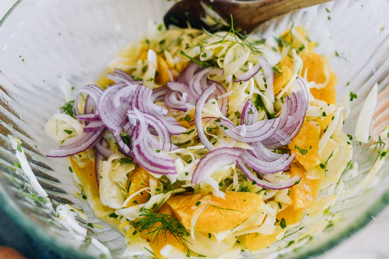 red onion, fennel, and orange segments in bowl