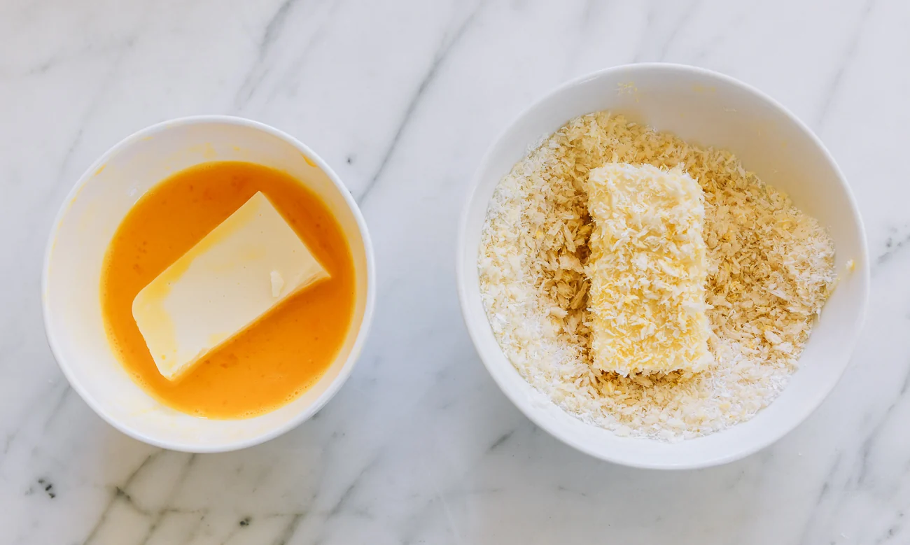 dredging milk pudding in egg and then coconut panko breadcrumb mixture