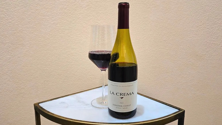 Bottle of La Crema Sonoma Coast Pinot Noir on small white table
