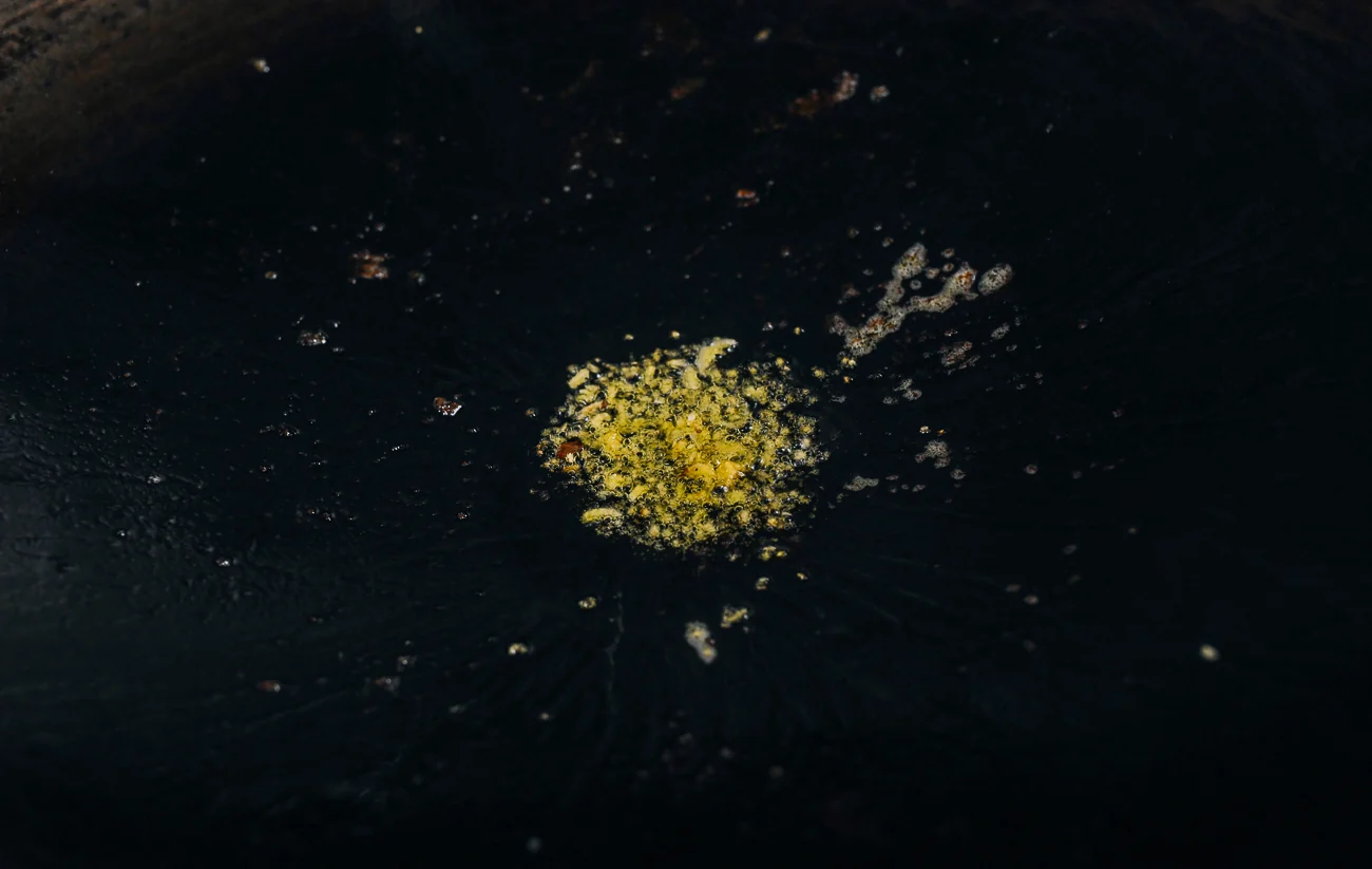 minced ginger in wok