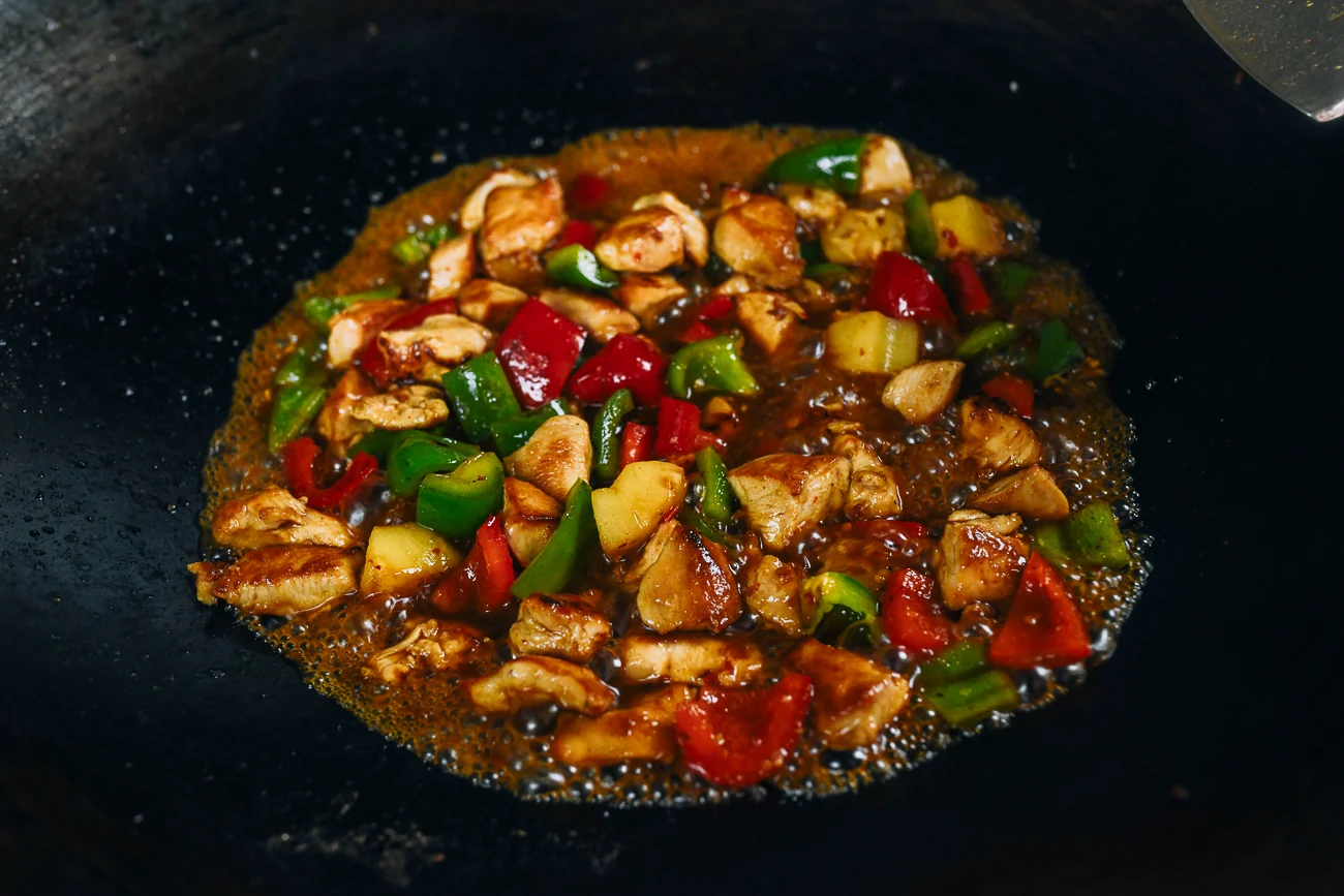 stir-frying pineapple chicken