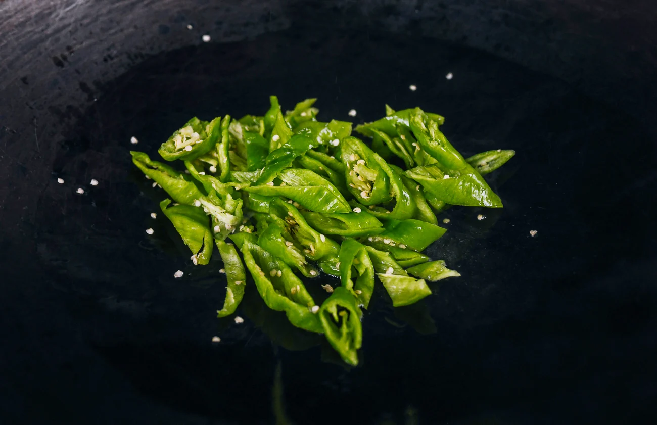long hot green peppers in wok