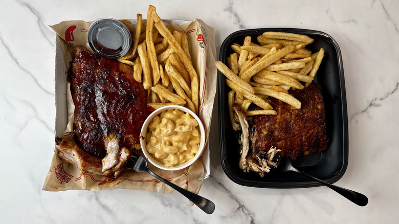 Chili's and Applebee's baby back ribs with fries in takeout containers with forks in the meat