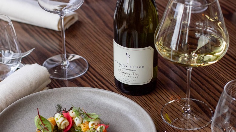bottle and glass of Craggy Range Winery Kidnappers Vineyard Chardonnay in front of dish